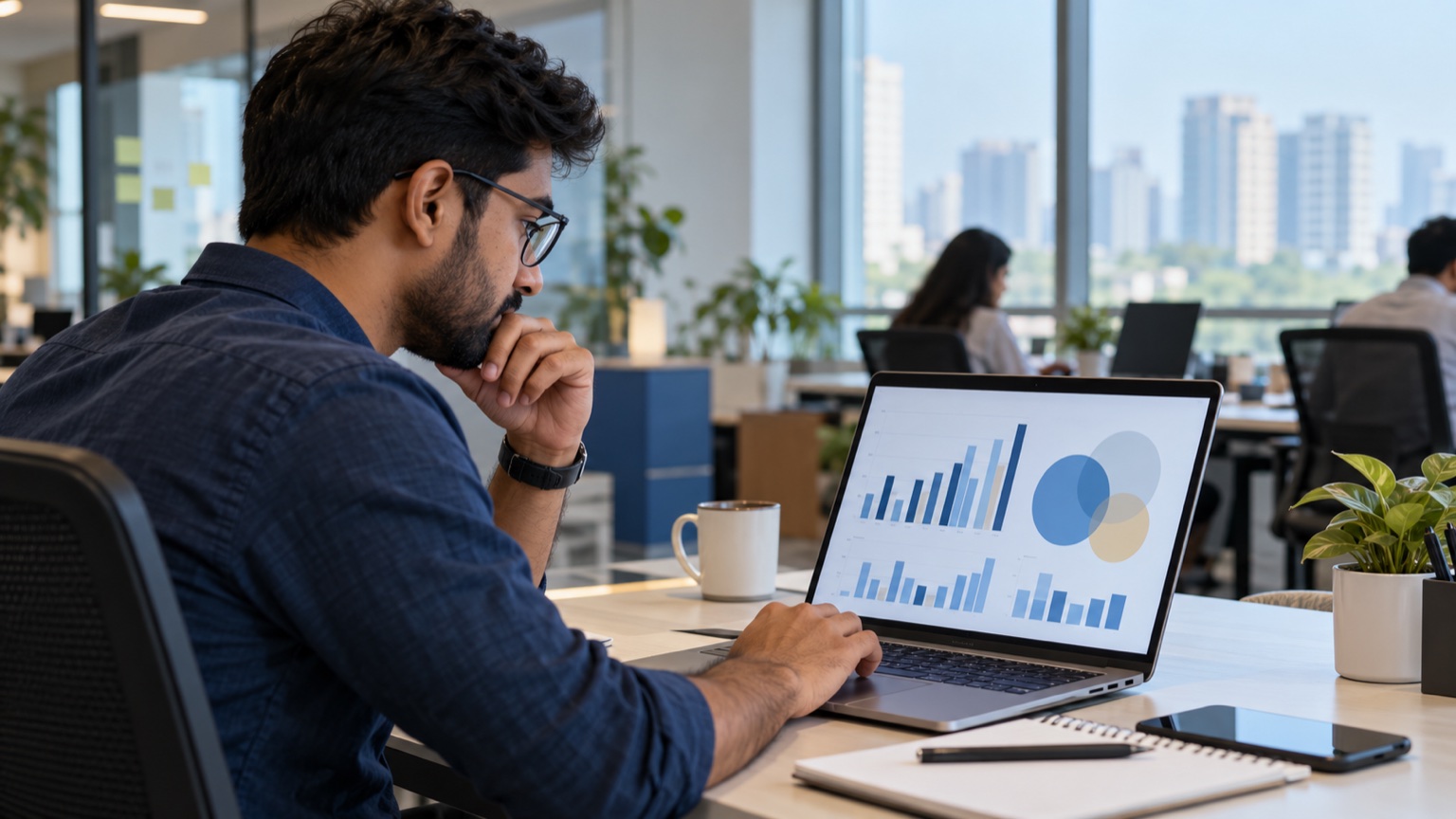 Digital marketing analyst reviewing abstract paid-search competition charts on a laptop